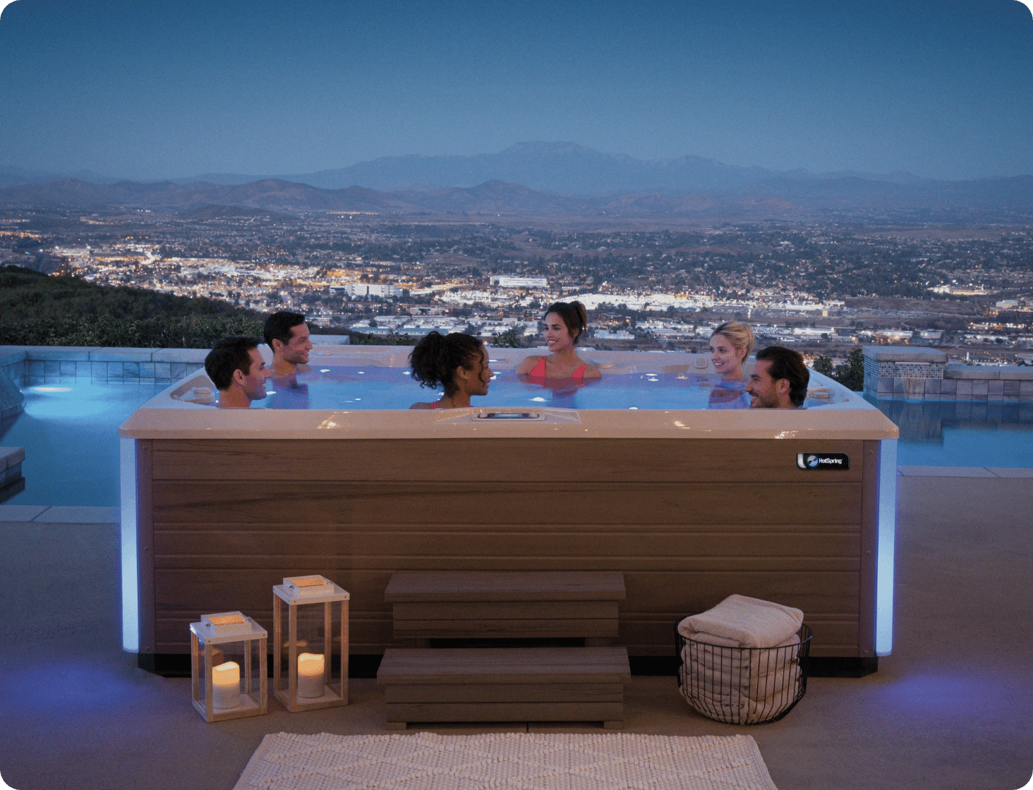 Group of friends enjoying a spa during sunset