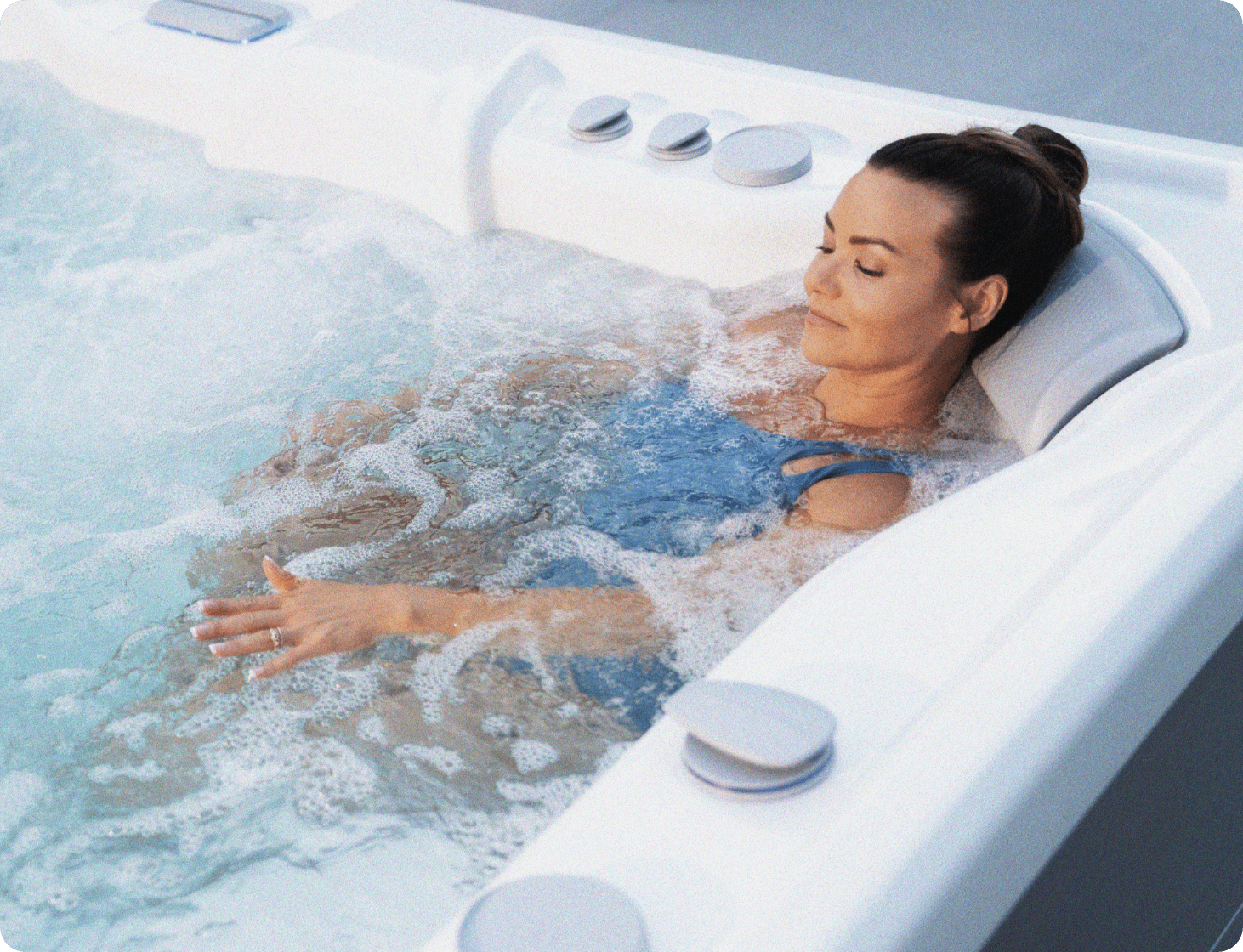 Lady in a spa with massage jets on